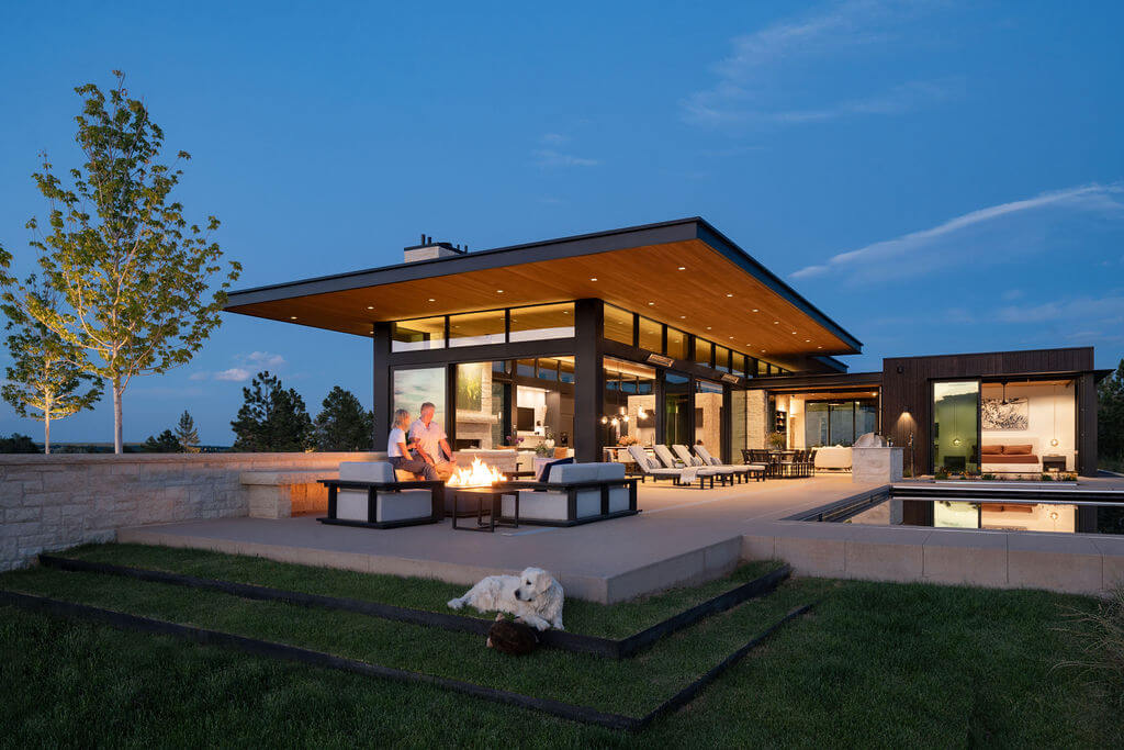 MaggiesFarm_SurroundArch-Exterior-NorthWest-Elevation-Pool-Twilight-2.-with-People